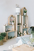 Festive ornaments on modular shelves made from various wooden boxes