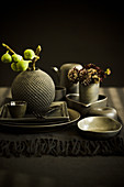 Autumnal arrangement with green figs on set table