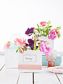 Spring flowers in small shopping bag