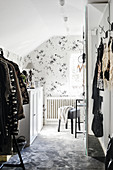 Floral wallpaper in dressing room with sloping ceiling