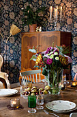 Autumnal decorations on table in old-fashioned dining room