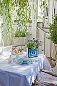 Crocheted ornament on romantic garden table set for tea