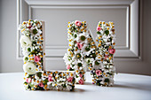 Ornamental letters romantically decorated with flowers