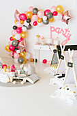 DIY balloon garland and wigwams in party room