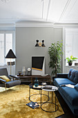 Elegant designer furniture in living room of period apartment