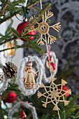 Christmas tree decorated with straw figurines