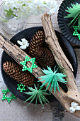 Festive arrangement of paper Christmas trees and bead stars