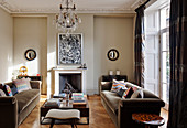Stucco ceiling and open fireplace in classic living room of period building