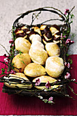 Basket of bread rolls decorated with fragrant flowers