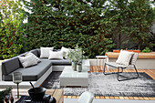 Grey outdoor furniture on elegant wooden terrace