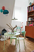 Lime-green table and chairs in vintage-style child's bedroom