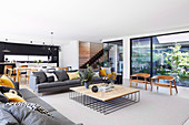 Modern open living room with window front to the courtyard