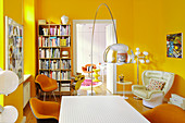Classic chairs in dining room with yellow walls
