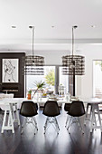 Modern black and white dining room with table on trestles