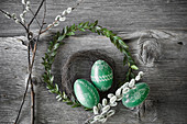 Hand-painted green Easter eggs with box and willow wreaths and pussy willow branches