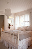 Double bed in vintage-style bedroom