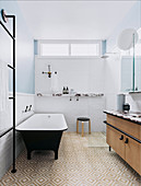 Freestanding bathtub, shower and vanity in the bathroom