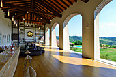 Elegant loggia with arched openings in renovated farmhouse