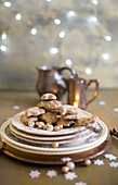 Plate of gingerbread biscuits with Christmas decorations