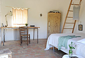 Desk in simple Mediterranean bedroom