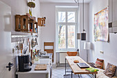 Narrow kitchen-dining room in period apartment in Berlin, Germany
