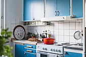 Fitted kitchen with blue cupboards