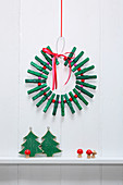 Christmas wreath made from green-painted clothes pegs