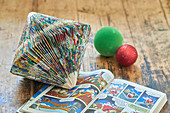 Prism-shaped Christmas decoration made from folded comic pages