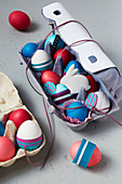 Decorated Easter eggs and Easter bunny in egg boxes