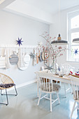 Festive decorations in dining room in pale grey and white