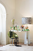 Buffet of sweets in sweet jars on mirrored console table