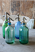 Old soda siphons made from green and blue glass