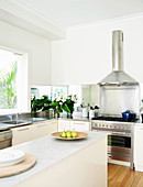 White kitchen with mirrored wall