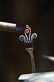 Heating fork tines with blowtorch