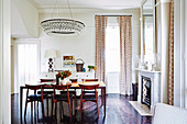 Elegant dining area with a long table and chandelier