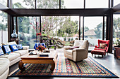 Lounge with Asian accessories and all-round glazing