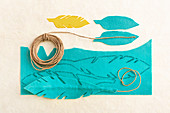 Instructions for making feathers from turquoise felt