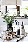 Table set with simple, rustic accessories and pastries