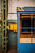 Blue office cubicle in old factory