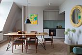 Simple fitted kitchen and dining area in open-plan interior