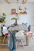 Rustic wooden table in dining room with autumn decorations