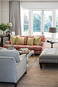 Scatter cushions on sofa in bright living room