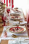 Festive place settings with gnomes and gold cutlery