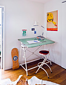 Vintage desk with stool in corner of room