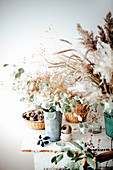 Wintry arrangement with dry grasses on table