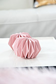 Ornaments made from folded pink paper