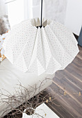 Lamp handmade from folded wallpaper