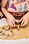 Children cutting Christmas cookies
