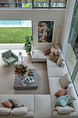 View from gallery of spacious sofa landscape in architect's house