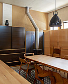 Wooden kitchen-dining room with fitted cupboards
